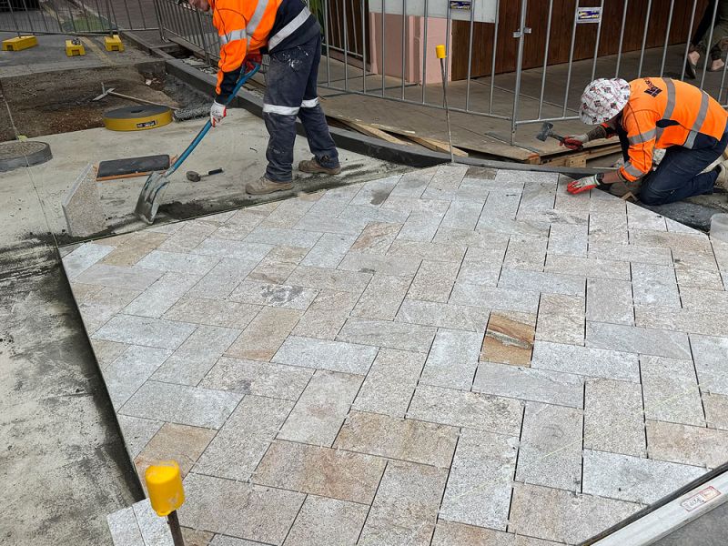 People laying pavers